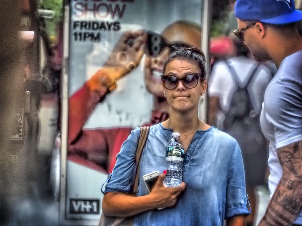 Woman With Water Bottle and Sunglasses