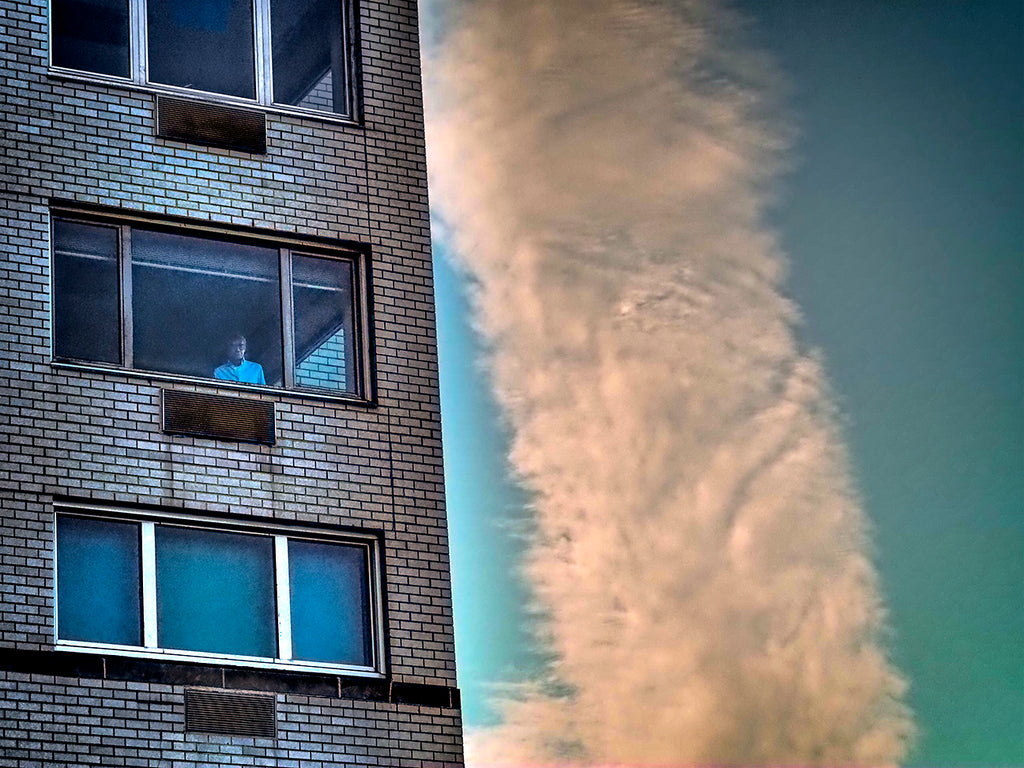 Man In Window With Cloud