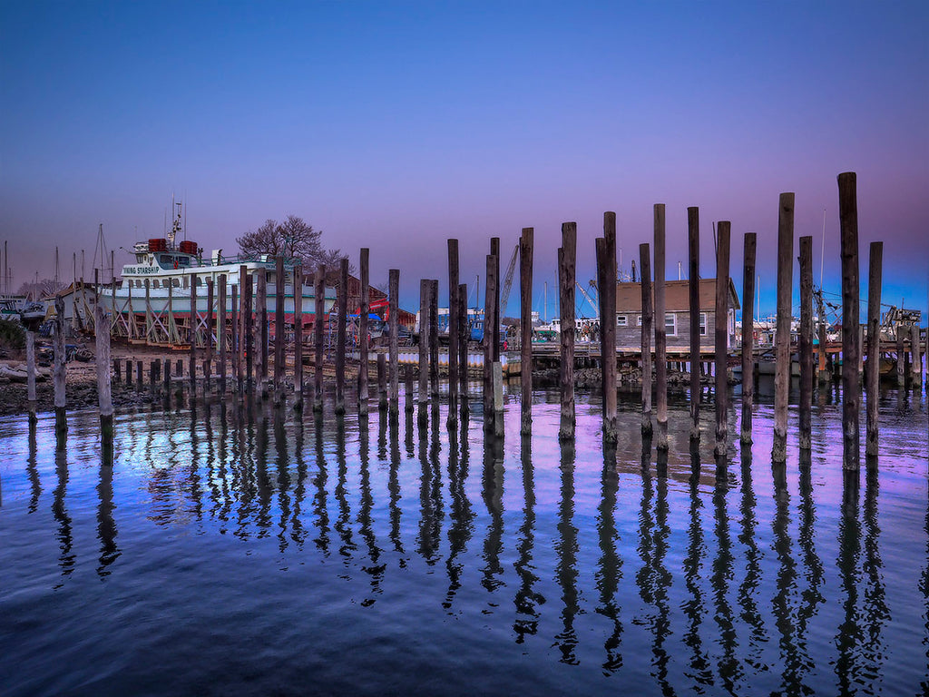 Pier Pilings And Boat